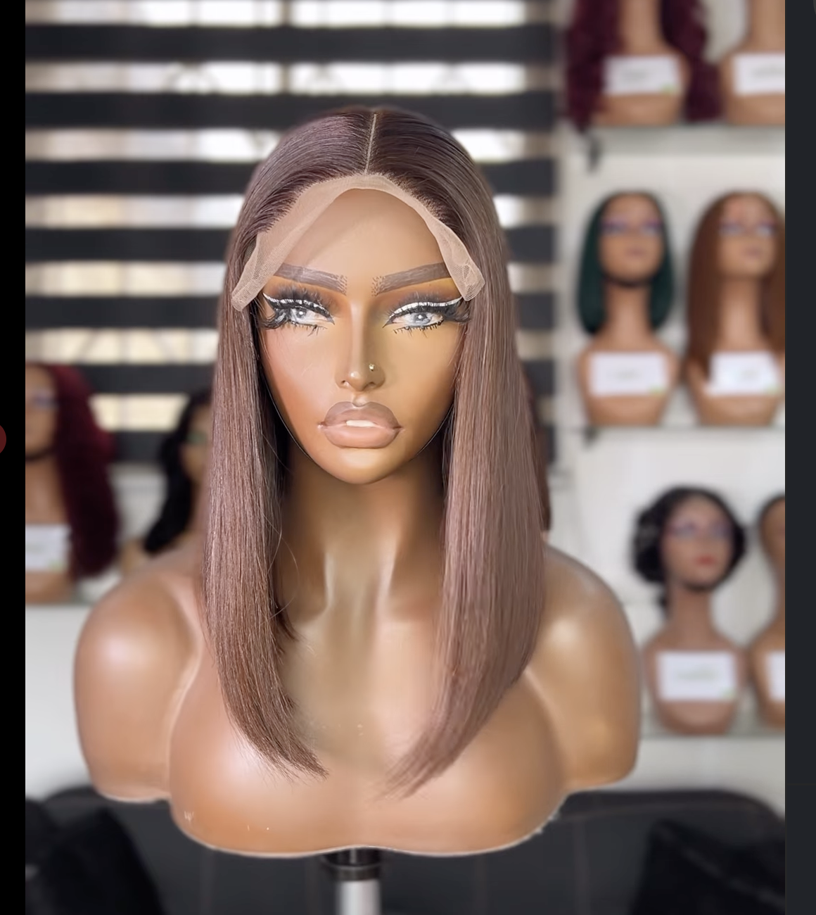 Beautiful woman showcasing premium wig and professional makeup at Rynie Beauty Hub